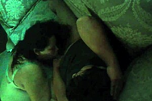 A wife secretly performs a blowjob on her husband using a hidden camera.