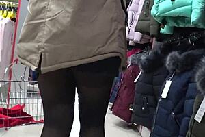 a hidden camera in a fitting room admires a juicy pawg and peeps on legs in a public mall voyeur fetishist
