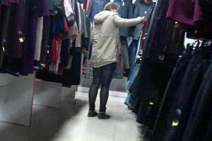 a hidden camera in a fitting room admires a juicy pawg and peeps on legs in a public mall voyeur fetishist
