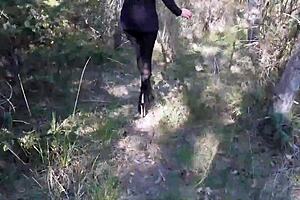 High heels and big ass in forest pantyhose walk