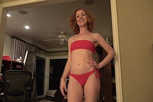 girl in red bikini shows off big ass