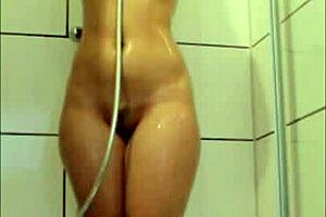 Watch sexydeas flaunt her big booty in steamy shower, teasing trimmed pussy