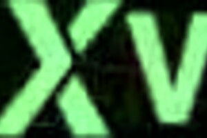 Goddess feet in white socks and jeans on spring grass