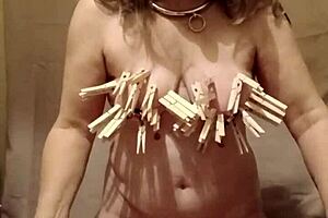 Slave Self-Spanks With Clamps And Belt