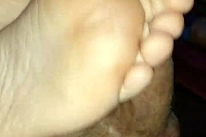 Watch this homemade footjob? Girlfriend's bare toes stroking for huge cumshot!