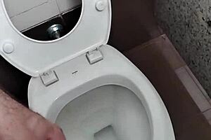 public bathroom scene with solo masturbation