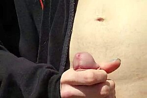 Outdoors, Husband Reaches Around To Finger Wife's Shaved Pussy