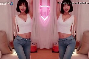 BJ Winter, the sexy Asian Korean, performs a seductive dance while teasing a blowjob.