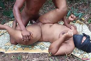 Thick ass ebony bitch fucks boyfriend in the bush.