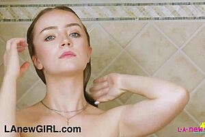 Cute Blonde Teen Enjoys a Steamy Shower Moment