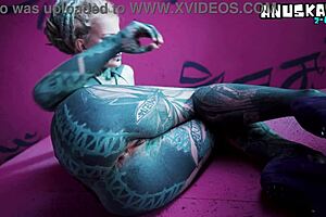 Is this tattoo girl stretching her asshole with toys?