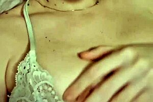 Elzakom shows off her sweet tits in lingerie.