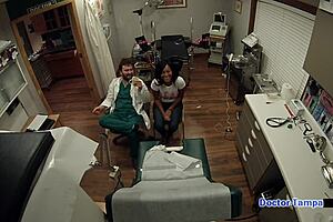 Dr. Tampa performs a pap smear on Tori Sanchez backstage in Florida.