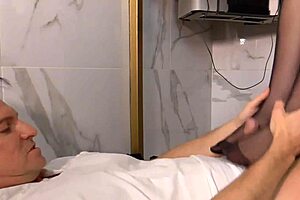 Nylon secretary gives a relaxing footjob in the office