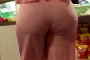 Mature milf shows off her big ass in casual setting.