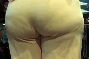 Mature milf shows off her big ass in casual setting.