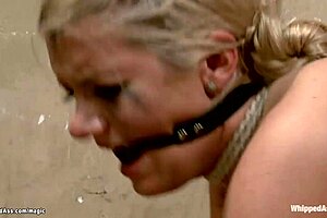 tied prostitute whipped and dominated in fetish scene