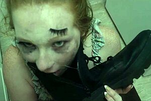enthusiastic redhead slut licks cum from boot in bdsm humiliation