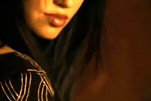 Glamorous brunette babe dances nude in a softcore scene