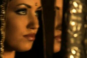 Glamorous brunette babe dances nude in a softcore scene