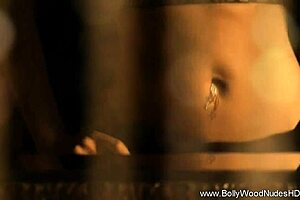 Glamorous brunette babe dances nude in a softcore scene