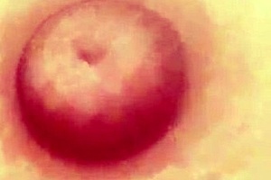 Nude woman dances topless in panties while teasing erotically