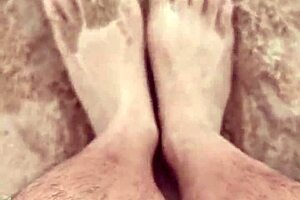 Bare feet exploring sandy shores