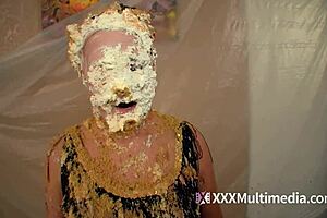 Two blondes get wet and messy and pie each other in the face.