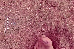 Bare feet exploring sandy shores