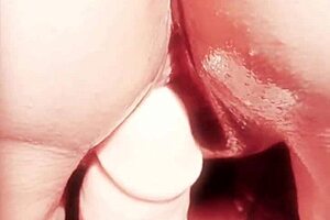 Mature woman teases wet shaved pussy with oiled toys in close up