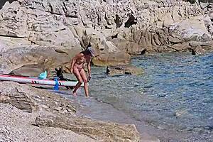 Hey, watch this couple pee on each other at nudist beach