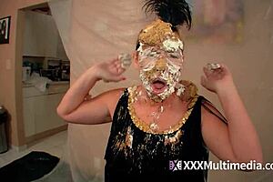 Two blondes get wet and messy and pie each other in the face.