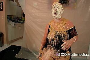 Two blondes get wet and messy and pie each other in the face.
