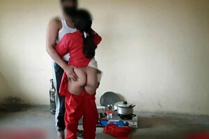 Indian stepsister engages in hardcore homemade sex with mommy in the kitchen during a quickie
