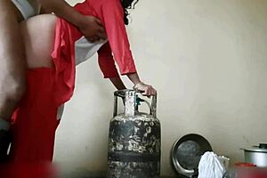 Indian stepsister engages in hardcore homemade sex with mommy in the kitchen during a quickie