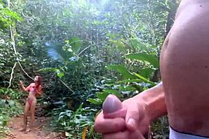 Risky handjob for cute brunette on beach trail
