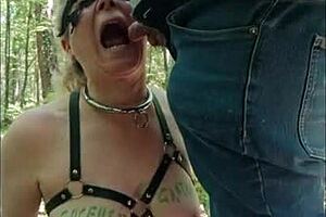 female slave in forest gets dogging, urine play, and blowjob