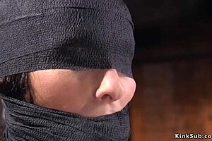 Hairy beauty in hogtie receives caning.