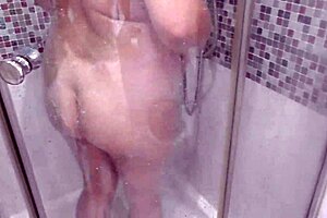 Mature wife with big tits in shower