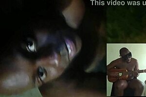 Blogging topless outdoors while adding sounds to songs in summer weather