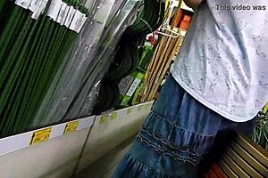 Mature woman flashes hairy pussy in public shop