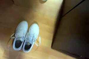 She wakes up early, slipping off her smelly socks to reveal bare feet for fetish fans.