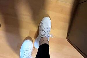 She wakes up early, slipping off her smelly socks to reveal bare feet for fetish fans.