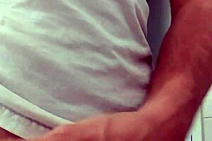 A guy strokes his cock until he cums.