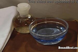 suggestive busty pale lesbian mistress whips her bound slave's big natural boobs hard