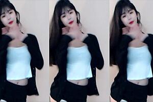 Chinese girl dances on roller coaster in bikini.