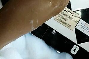 in the motel bathtub, enjoying masturbation with a big toy.