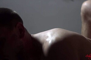 The handsome hunk breeds the trainer anally and makes him cum.