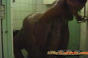 two horny african lesbians with big booties kiss and play in the shower!