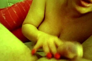 A couple shares an intimate closeup blowjob and handjob leading to cumshot
